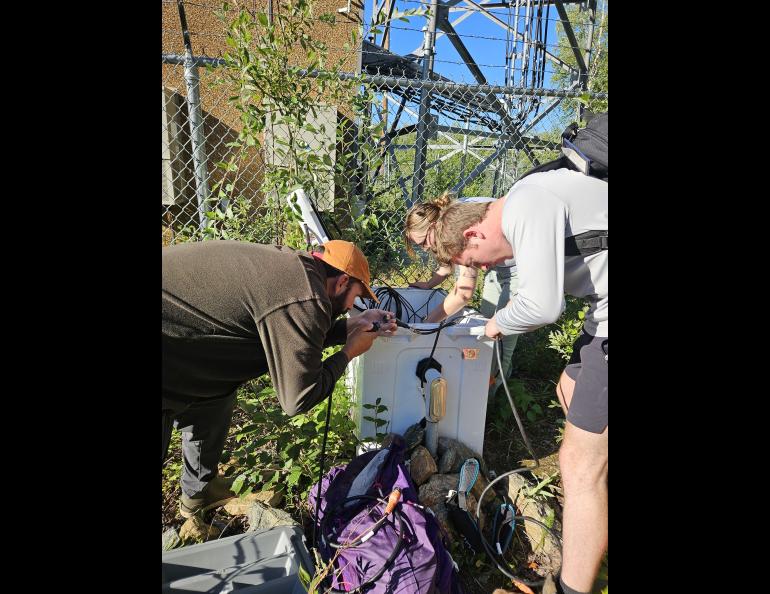 An Alaska Earthquake Center team works with cables and equipment at seismic station NEA2 north of Nenana, Alaska, about a year before the Aug. 20, 2025, earthquake. The station is approximately 10 miles south of the earthquake’s epicenter.