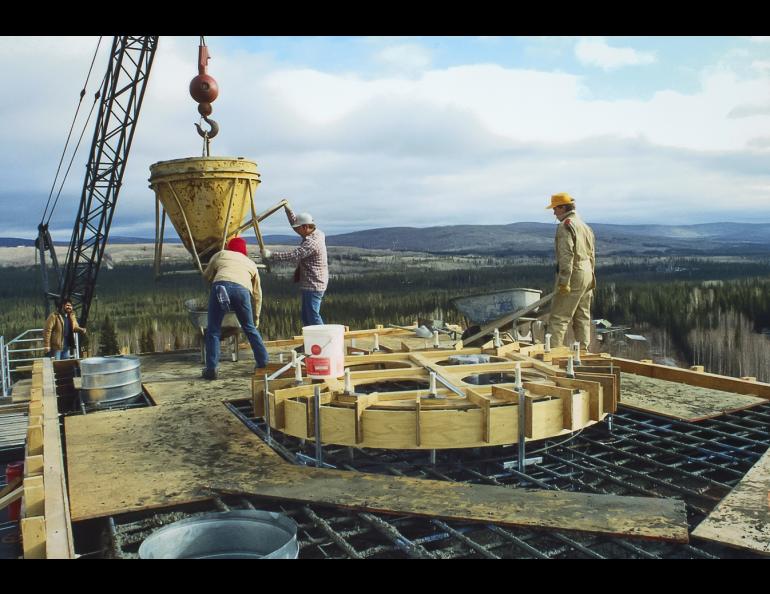 Pouring the concrete to prepare a platform for the 10-meter ASF antenna on the roof of the Elvey Building in 1988. 