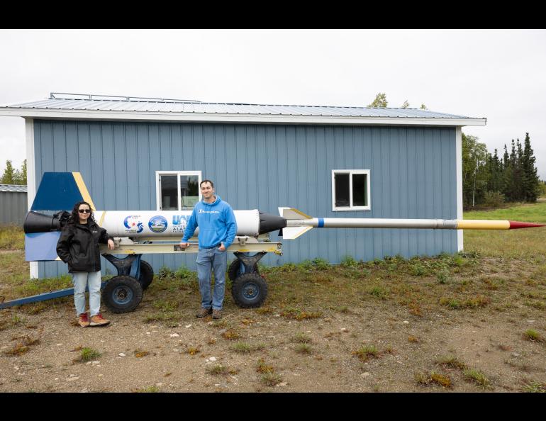 Alejandra Marquez and Bradley Fulton pose next to the "parade rocket" during the Poker Potluck Pig Roast on Aug. 23, 2024. Photo by Bryan Whitten