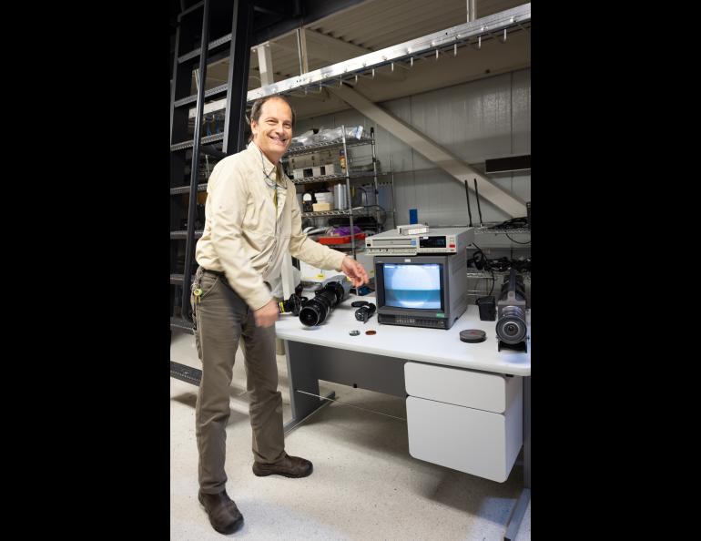 Don Hampton gives a demonstration of cameras that are used for research at the Neal Davis Science Operations Center during the Poker Potluck Pig Roast on Aug. 23, 2024. Photo by Bryan Whitten