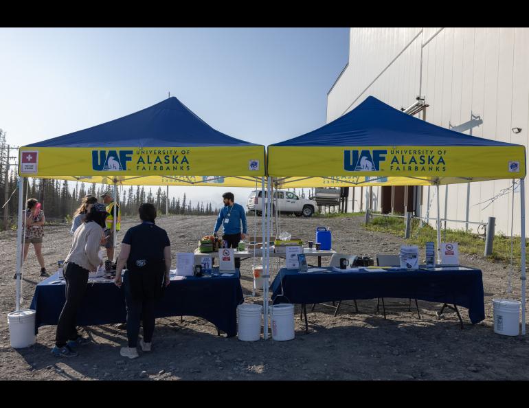 The welcome tables at the Saturday, June 14 HAARP Open House minutes before the gates opened to the public. Photo by Bryan Whitten