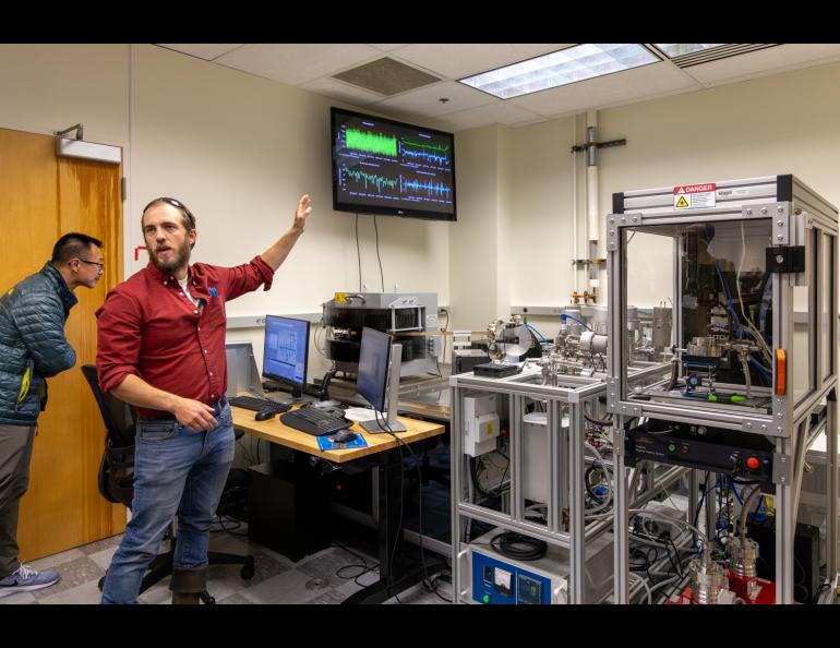 Geochronology Lab Director Sean Regan explains the working of the lab to some attendees of a public meeting about carbon ore, rare earth elements and critical minerals earlier this month. UAF/GI photo by Courtney Holtzclaw