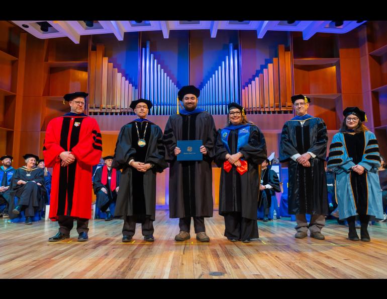 Austin Smith with Chancellor Sfraga and Interim Provost Charlene Sterm while CNSM Dean Karsten Huffer, Peter Delamere and Doğacan Öztürk look on. Photo by Eric Engma
