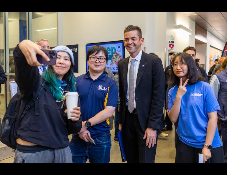 Three students gather for a selfie with NASA Administrator Jared Isaacman