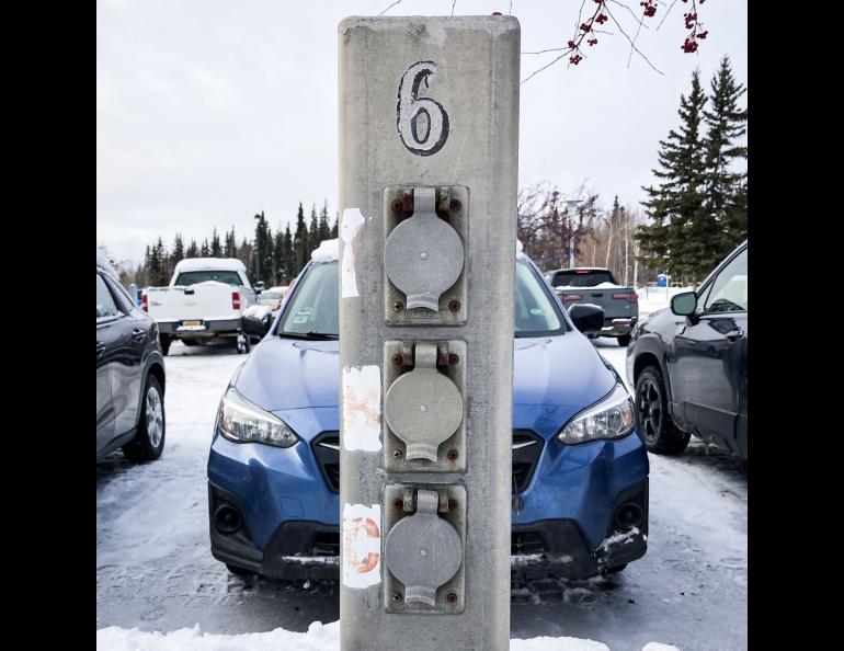 This kind of block heater outlet can accomodate THREE cars if one car is parked right in front of it.