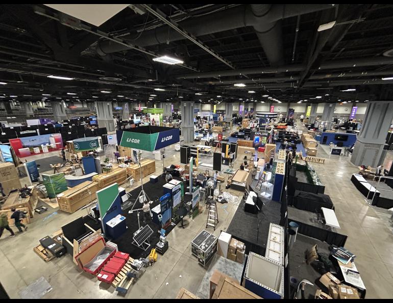 The exhibit hall is bustling with activity as all of the participants are putting their booths together. Photo by Rod Boyce