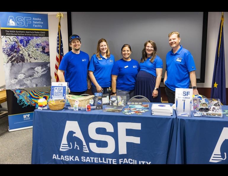 Alaska Satellite Facility staff gather for a photo during the 2023 Arctic Research Open House. UAF/GI photo by JR Ancheta.