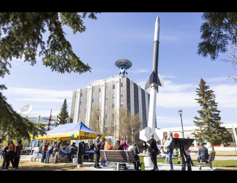 Vistors queue up for ice cream in front of the rocket during the 2023 Arctic Research Open House May 18, 2023 at the Troth Yeddha' campus in Fairbanks. UAF/GI photo by JR Ancheta.