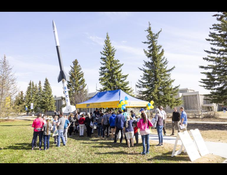 Vistors queue up for ice cream in front of the rocket during the 2023 Arctic Research Open House May 18, 2023 at the Troth Yeddha' campus in Fairbanks. UAF/GI photo by JR Ancheta.
