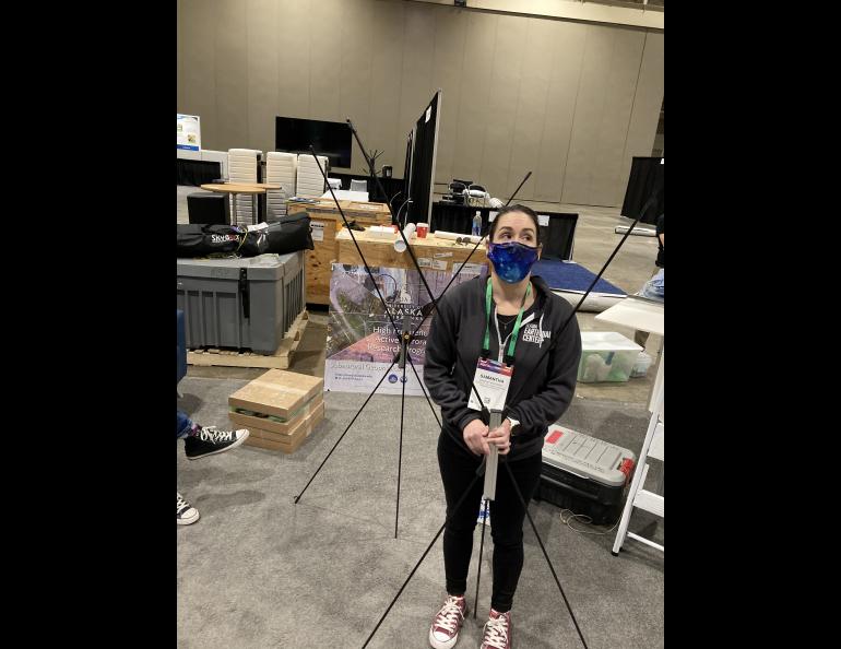 Samantha Wiser assists with assembling some other parts of the booth display. Photo by Kelly Eagan
