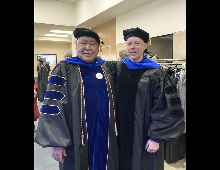 Emeritus Associate Professor of Yup'ik Language Stephen "Walkie" Charles and Emeritus Science Writer Ned Rozell paused for a photograph in the UAF Great Hall after the May 1 Gold Ceremony. Photo by LJ Evans