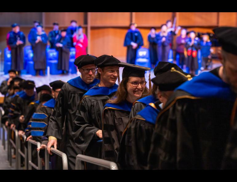 Ph.D. recipients exit the auditorium during the 2025 Ph.D. Hooding Ceremony in the Davis Concert Hall on the UAF campus, Friday, May 2, 2025. UAF photo by Eric Engman