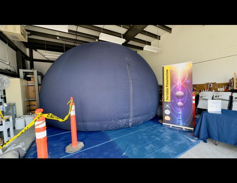 The GI's portable planetarium, seen here in fully deployed and zipped up mode, can accommodate about 30 people, a few more if childen, to view special presentations about space, the aurora and other topics. Photo by Jessica Matthews