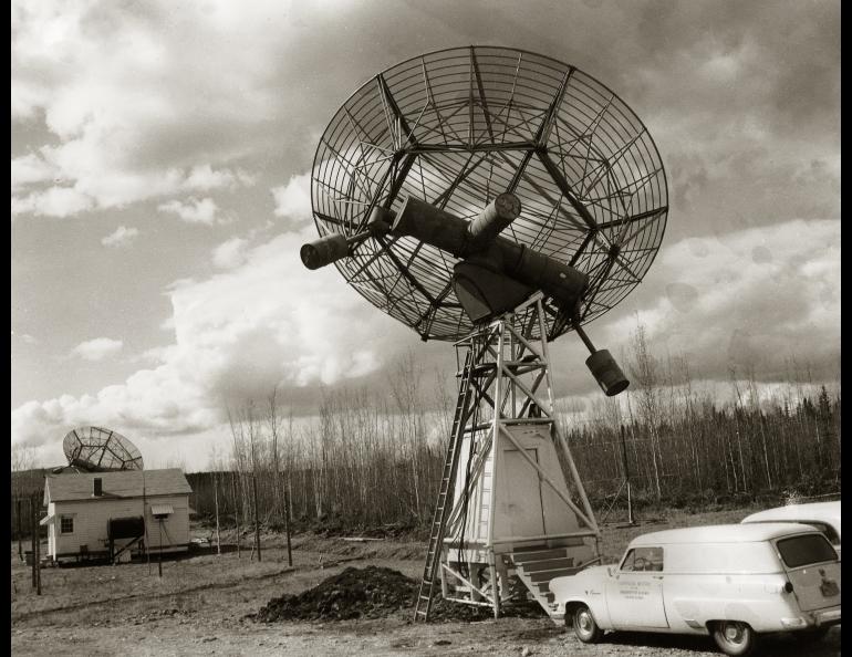 The GI's radio telescop facility on Ballaine, circa 1957. Note the door of the nearest vehicle says "Geophysical Institute of the University of Alaska, College Alaska." Geophysical Institute photo.
