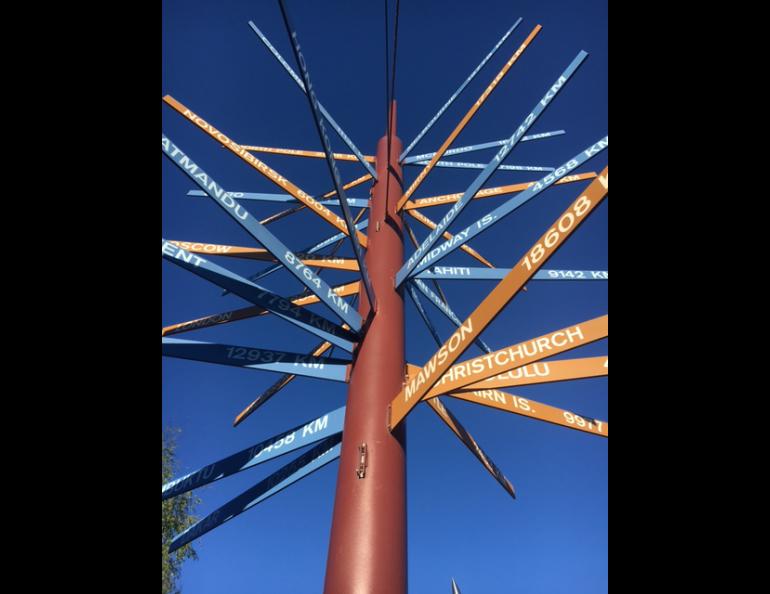 The International Signpost installation in front of the Elvey Building. Geophysical Institute photo by LJ Evans.