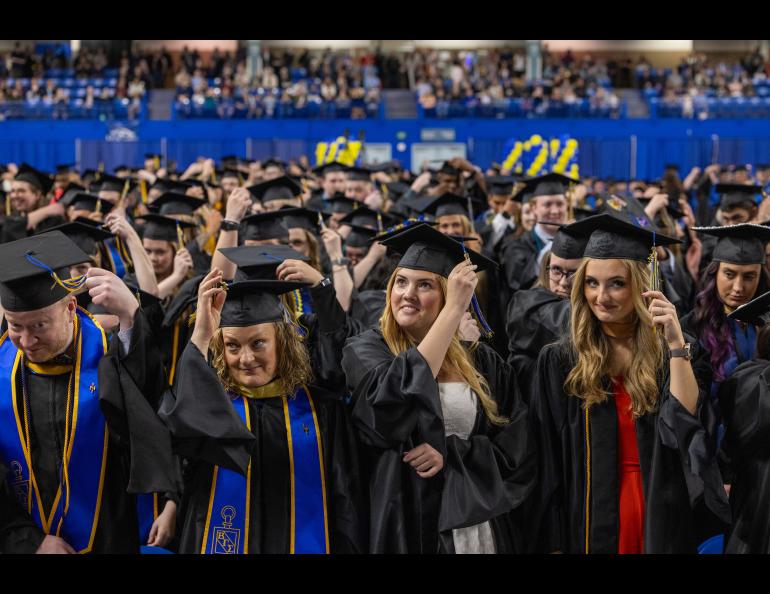 Graduates turn their tassels during the 2025 University of Alaska Fairbanks Commencement Ceremony Saturday, May 3, 2025 at the Carlson Center. UAF photo by Eric Engman