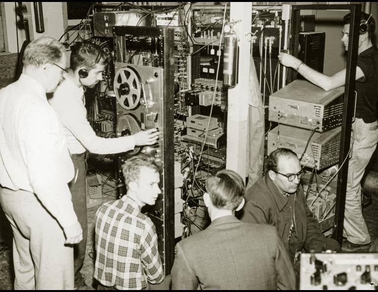  Researchers from the Geophysical Institute track the Sputnik 1 satellite in the Ballaine Lake tracking station, October 1957. From left are Bob Merritt, Joe Pope, Pete Michelow, Gordon Little, Glen Stanley and Ernest Stiltner. Photo courtesy the Geophysical Institute, UAF. 