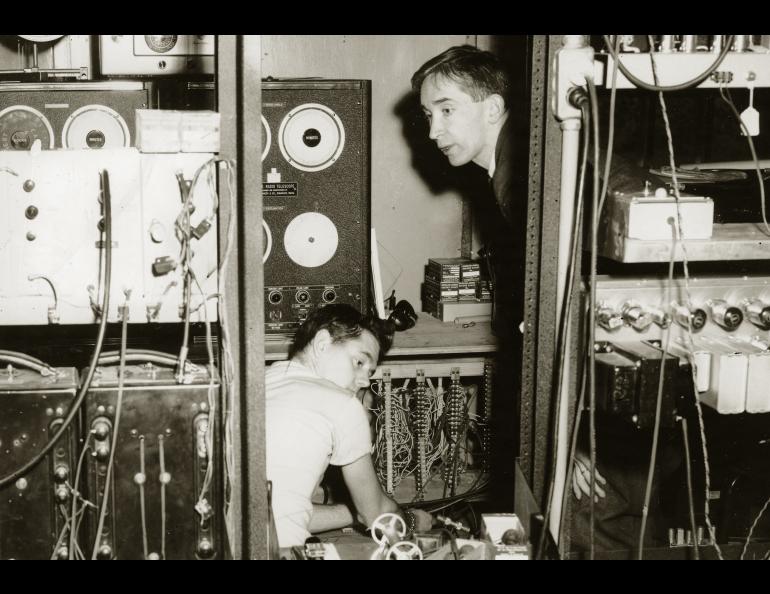  Researchers from the Geophysical Institute — Ernest Stiltner, left, and Gordon Little — track the Sputnik 1 satellite in the Ballaine Lake tracking station, October 1957.  Photo courtesy the Geophysical Institute, UAF. 