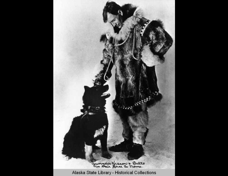 Serum Run musher Gunnar Kaasen poses with Balto, a leader on his mushing team. Alaska State Library Portrait File.