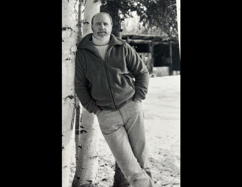 Dale Guthrie leans against a birch tree outside his home in Fairbanks. Photo by Mary Lee Guthrie.