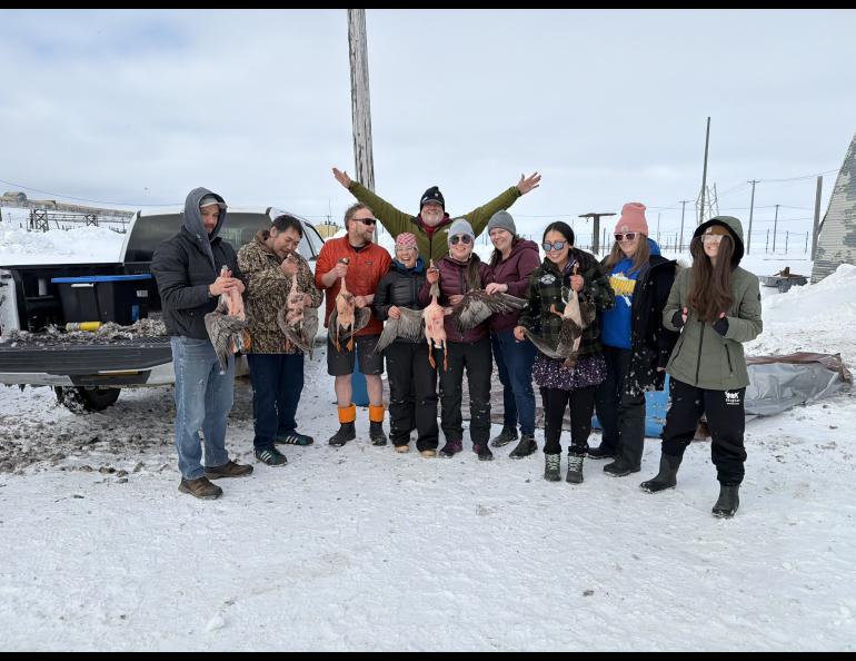 Group of people with harvested geese