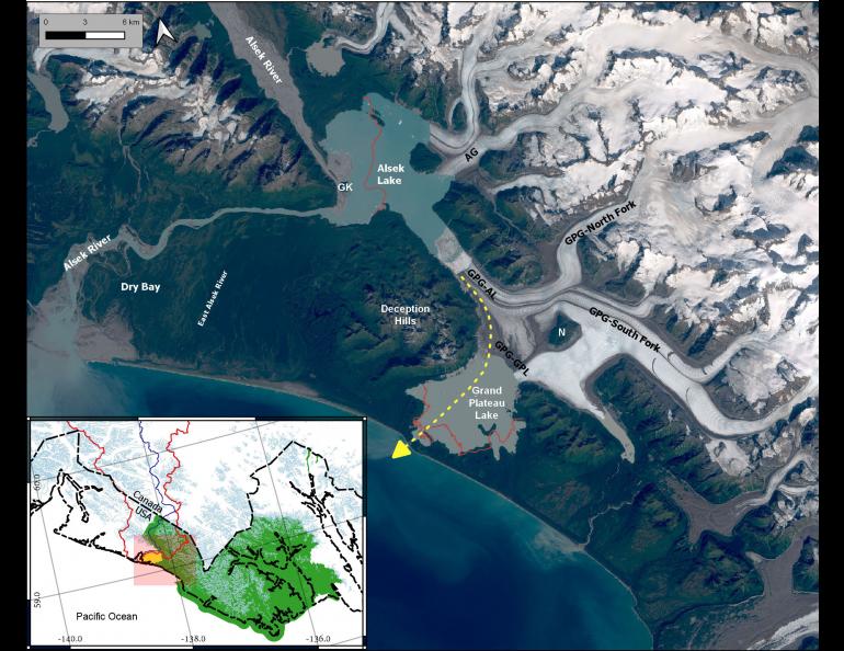 A satellite image showing the Alsek River and Grand Plateau Glacier in southern Alaska. The yellow dashed line represents where the Alsek River may soon flow due to extreme melting of Grand Plateau Glacier (labeled GPG). In the early 1900s, Alsek Glacier (AG) was connected to Grand Plateau Glacier.
