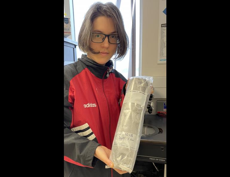 Josephine Galipon of Keio University in Japan holds a cylinder of frozen soil extracted by her colleague Go Iwahana from the U.S. Army’s Permafrost Tunnel Research Facility in Fox, Alaska. She is looking for microorganisms that might still be alive in the ancient soil. Photo by Ned Rozell.