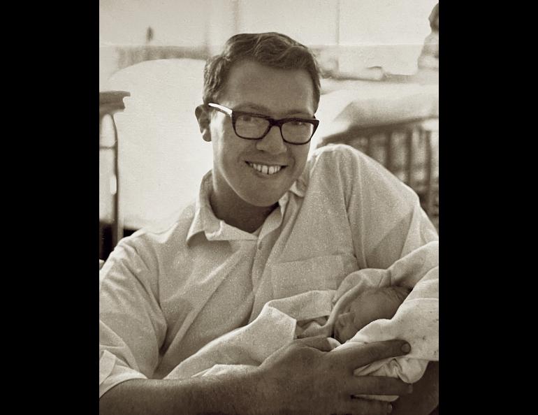 Neal Brown in 1967, holding his newborn son Kris. Photo courtesy Kris Brown.