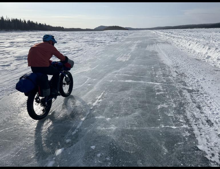 Ned Rozell rides a plowed winter road on the Yukon River that allows cars and trucks to drive between Manley Hot Springs and the village of Tanana in the winter. Photo by Forest Wagner.