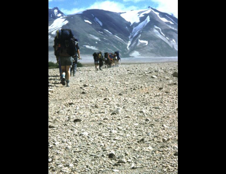 Hikers enter the Valley of Ten Thousand Smokes on the Alaska Peninsula, walking on a sheet of ash and volcanic rock more than 500 feet thick.