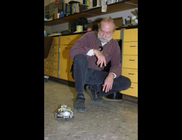 Rick Ruhkick, an engineering technician with the Geophysical Institute’s electronics shop, watches his robot Sparky. Ruhkick and a team of 11 others are attempting to create another autonomous vehicle that would be able to travel from Los Angeles to Las Vegas unaided. The winner of a Department of Defense-sponsored contest gets $1 million. Ned Rozell photo.