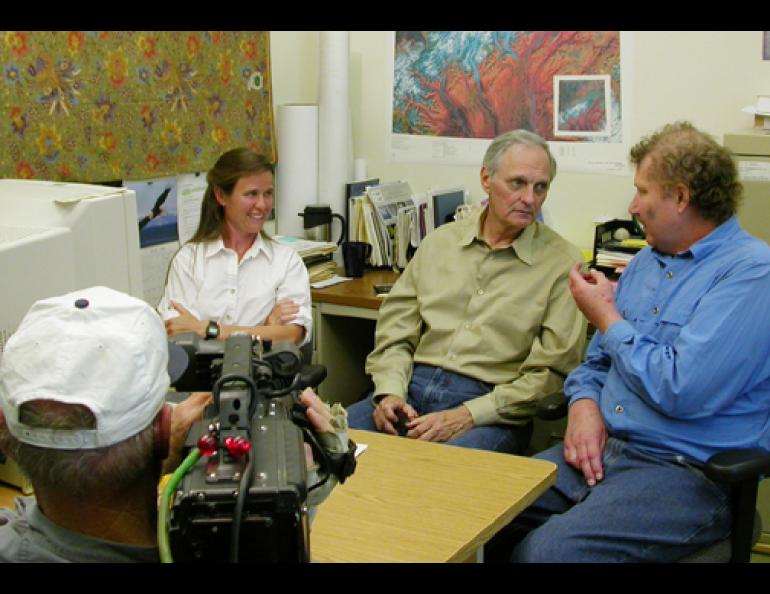 Alan Alda listens to glaciologists Keith Echelmeyer and By Valentine as Peter Hoving films possible footage for a Scientific American Frontiers special on warming in Alaska. Ned Rozell photo.