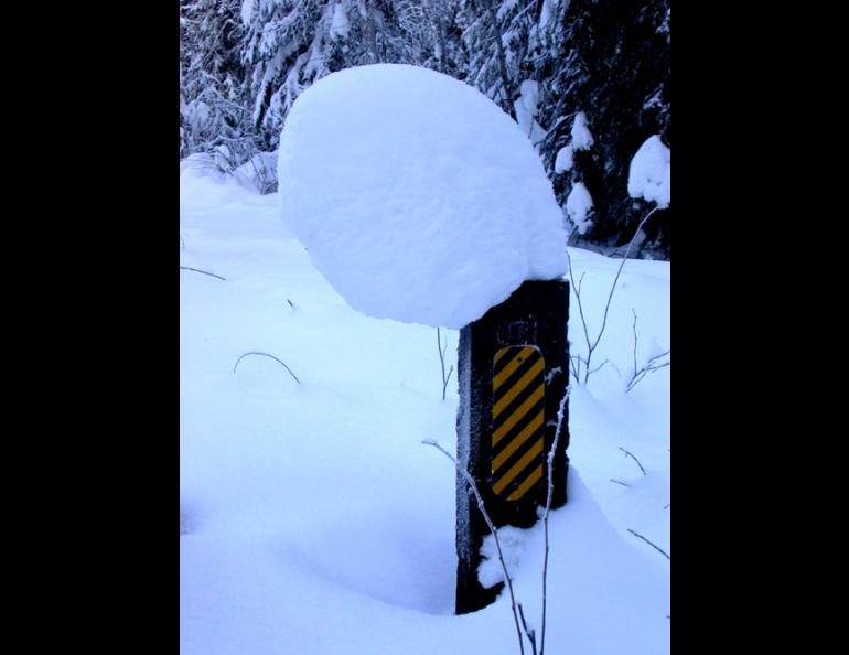 A leaning tower of snow on a Fairbanks post. Ned Rozell photo.
