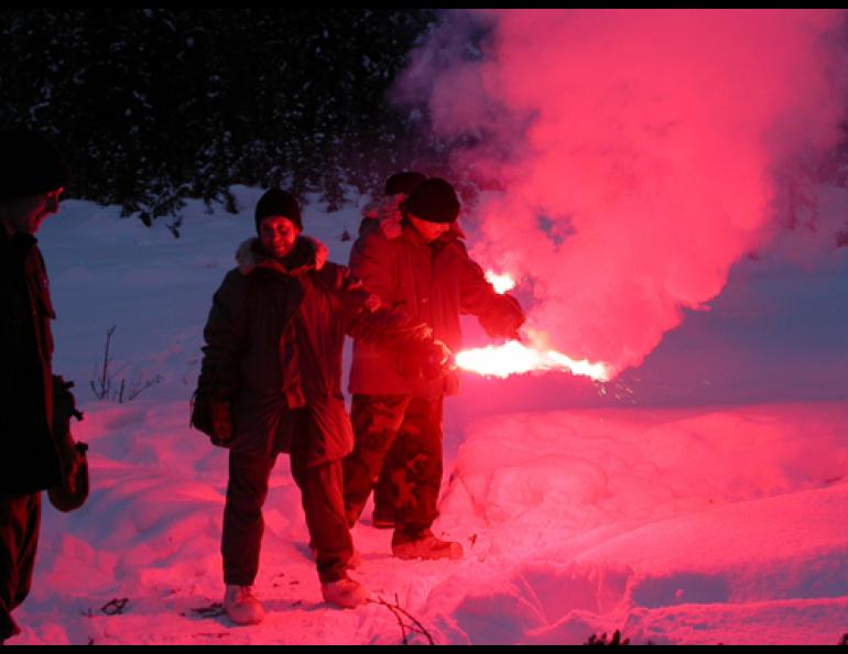 Air Force Capt. Nicole Drevet holds a signal flare during Arctic Survival Training School at Eielson Air Force Base. photos by Ned Rozell