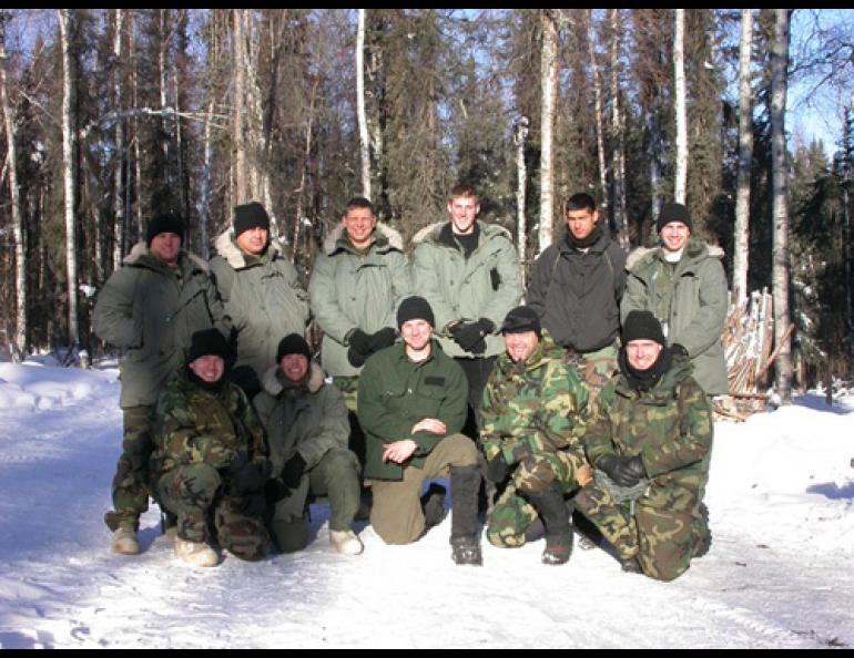 The class of Eielson Air Force Base’s Arctic Survival Training School for the week of Feb. 28, 2005-March 4, 2005. Kneeling at center is one of the instructors, Senior Airman Jason Clapper. photos by Ned Rozell