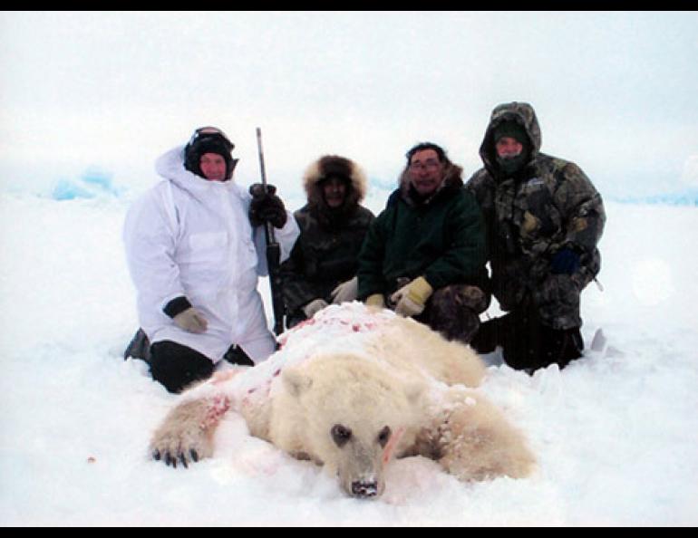  American hunter Jim Martell, left, is seen with a hybrid bear he shot while on a hunting expedition on Banks Island, Northwest Territory, Canada, in April 2006. Genetic tests showed the bear had a polar bear for a mother and a grizzly bear for a father. Roger Kuptana, center, right, was the guide on the expedition. The other men are unidentified. (AP Photo/Canadian Wildlife Service) 