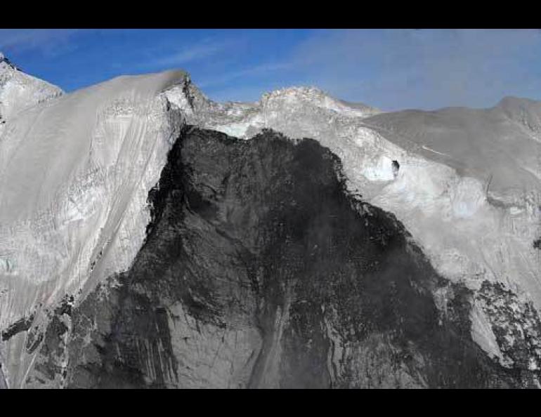  A 35-foot diameter hole appears in ice near the top of Mount Steller. The hole may be a conduit for water that may have contributed to an epic avalanche. Ruedi Homberger photo, courtesy of Ultima Thule Lodge. 