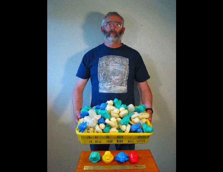 Dean Orbison poses with his collection of floating toys that were found while beachcombing. The toys fell off a ship in the North Pacific in 1992 and made their way to Southeast Alaska, near Orbison's home in Sitka.