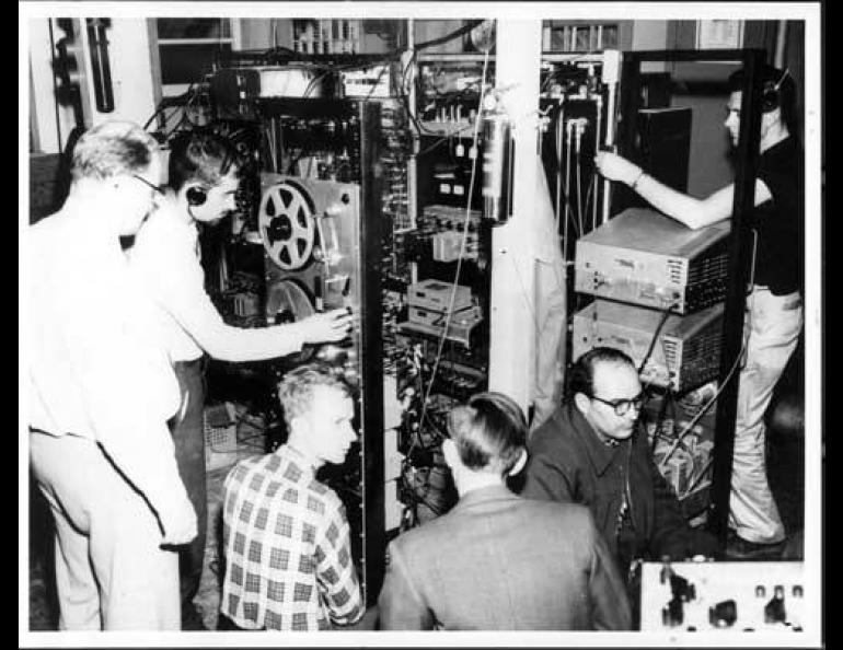  Researchers from the Geophysical Institute track the Sputnik 1 satellite in the Ballaine Lake tracking station, October 1957. From left are Bob Merritt, Joe Pope, Pete Michelow, Gordon Little, Glen Stanley and Ernest Stiltner. Photo courtesy the Geophysical Institute, UAF. 