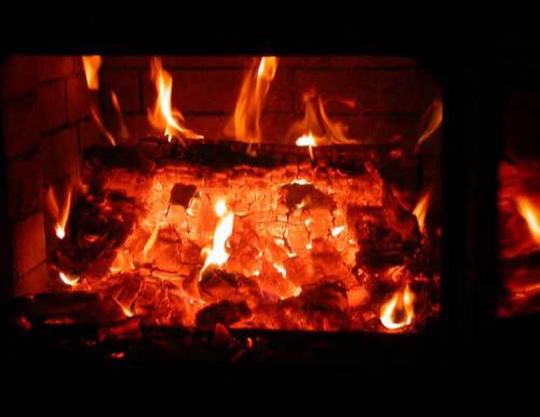  Coals from the firebox of Bill Reynolds’ masonry heater. Photo by Ned Rozell 