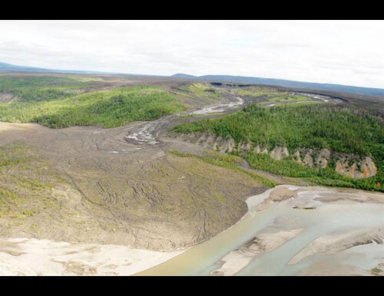  A retrogressive thaw slump on the Bonnet Plume River, which flows into the Peel River in northern Yukon Territory. The top of the feature is about a half-mile-wide. The mudflow extends more than one mile. Photo by Doug Davidge. 