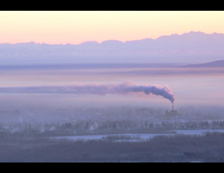 Downtown Fairbanks is blanketed in ice fog beneath the exhaust of a coal-fired power plant in January 2012. Photo by Ned Rozell.