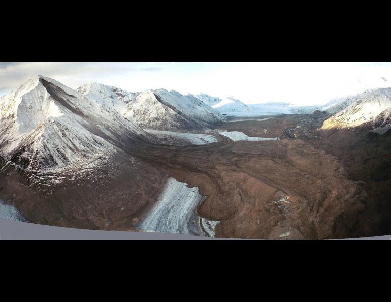 USGS glaciologist Dennis Trabant took this composite photo of rock avalanches that occurred on upper Black Rapids Glacier during the earthquake. This photo, two images stitched together by the USGSs Rod March, shows a view looking west toward the divide of Black Rapids and Susitna glaciers. Dennis Trabant photo.