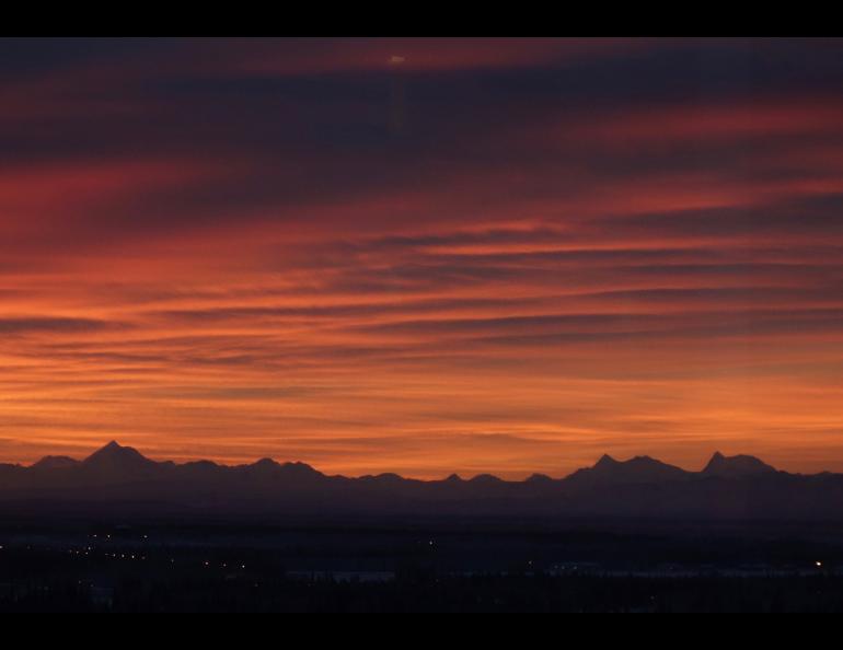 The Alaska Range sits beneath a December sunrise as seen from the UAF campus. Photo by Ned Rozell.