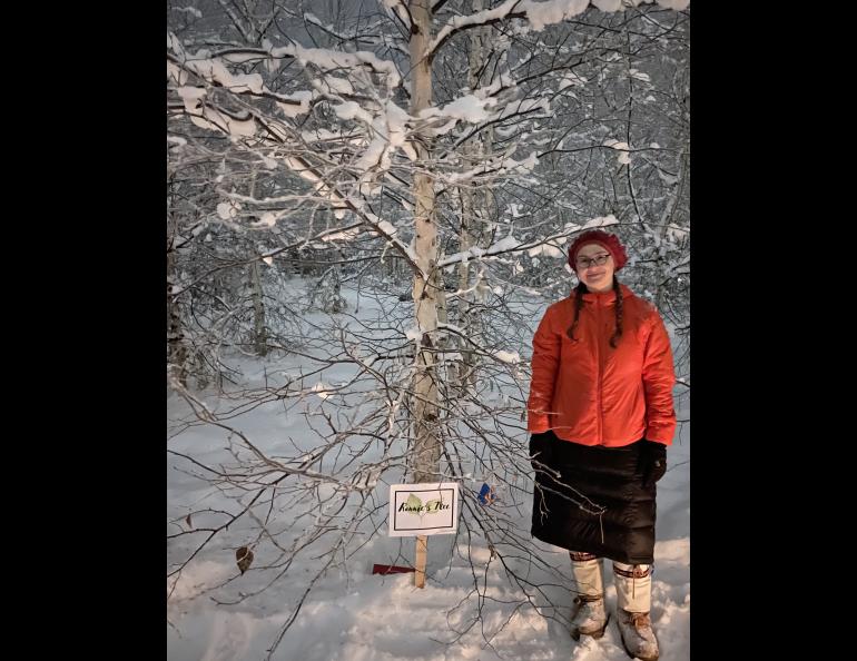 Annemarie Timling stands near a birch tree she helped choose to honor her father Ronnie Daanen, who died in a helicopter crash in July 2023. Photo by Ned Rozell.