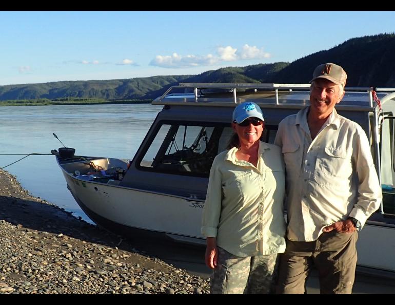 Chris Florian, left, and Skip Ambrose pose on the bank of the Yukon River during a trip to monitor peregrine falcon nests in July 2018. Photo by Ned Rozell.