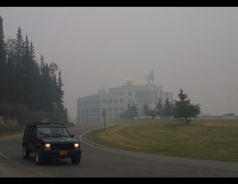 The Akasofu Building on the University of Alaska Fairbanks campus is bathed in smoke during the dramatic summer of 2004. Photo by Ned Rozell.
