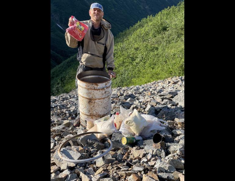 Glaciologist Martin Truffer holds raisins that had been preserved for more than 20 years in a barrel cache scientists left on Fireweed rock glacier near McCarthy. Photo by Ned Rozell.