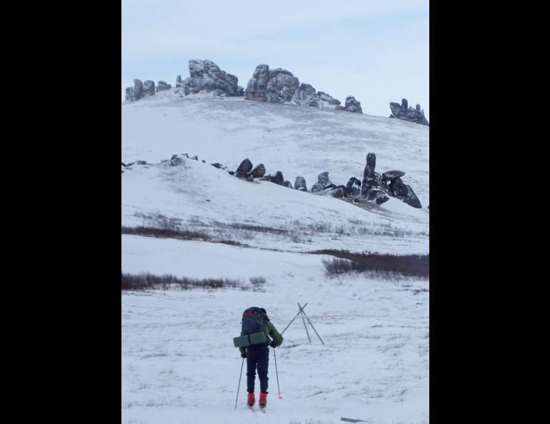 John Shook skis toward granite tors located near Serpentine Hot Springs on the Seward Peninsula. Photo by Ned Rozell.