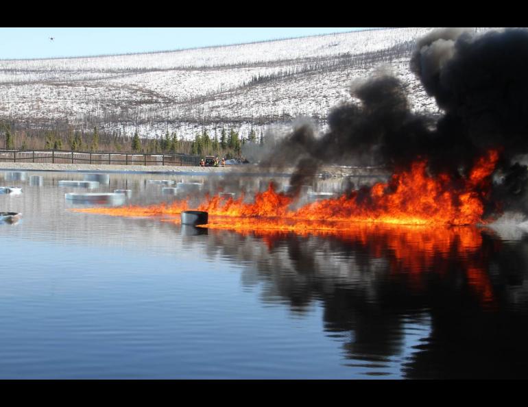 Oil burns on a manmade water basin at Poker Flat Research Range in April 2015. Photo by Len Zabilansky.